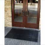 SuperScrape all-rubber mat outside brown door